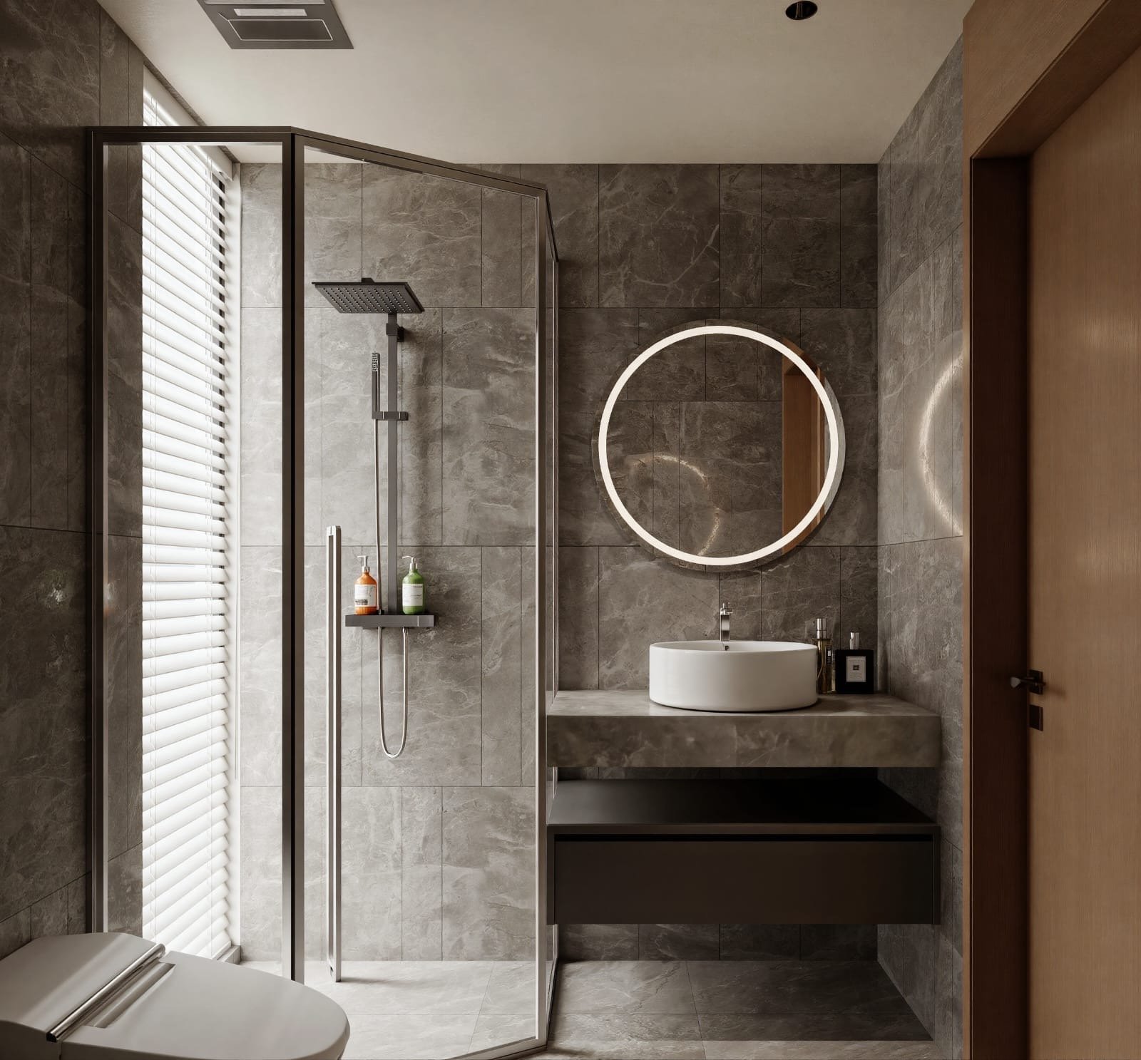 Baño en porcelanato gris con ducha vidriada, espejo circular retroiluminado y bacha de apoyo — Tucumán 319